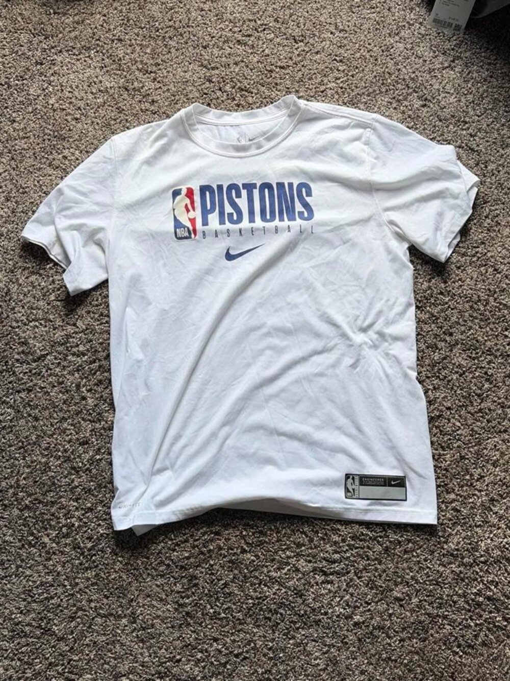 White Nike Detroit Pistons basketball tee with blue...